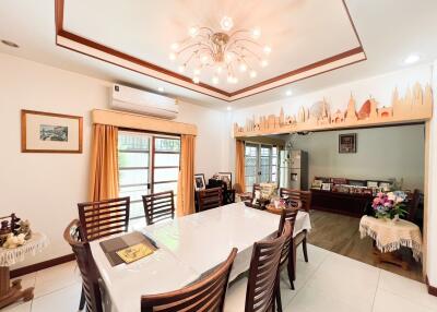 Spacious dining room with a table, chairs, and decorative elements