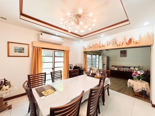 Spacious dining room with a table, chairs, and decorative elements