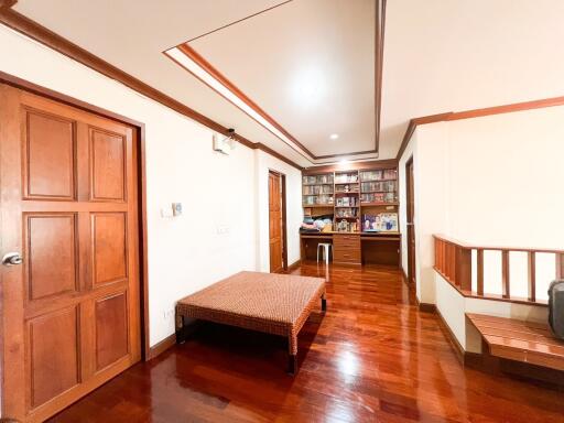 Spacious living room with wooden furniture