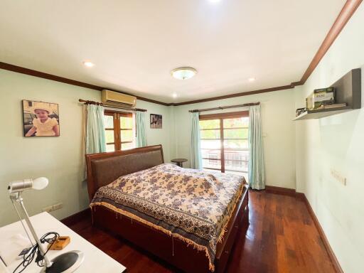 Spacious bedroom with double bed and natural lighting