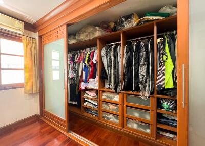 Spacious bedroom with large built-in wardrobe