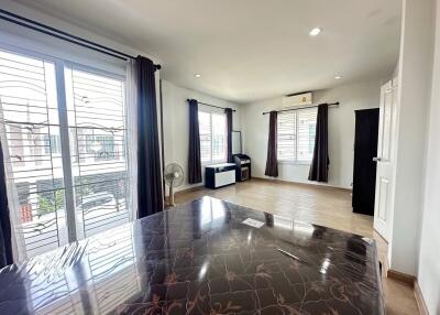 Spacious and well-lit living room with large windows