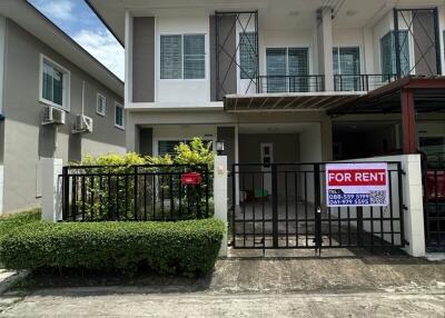 Two-story house with gated entrance and 