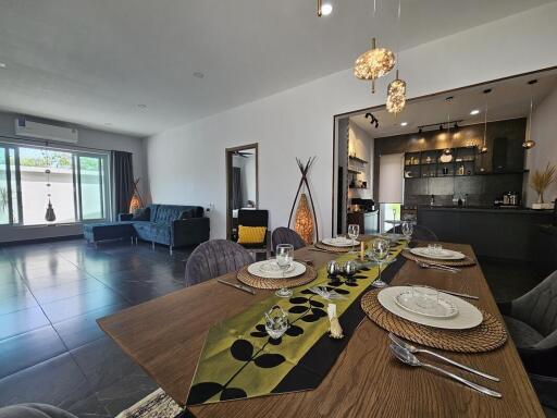 Modern living room with dining area and open kitchen