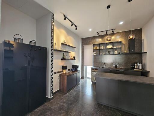 Modern kitchen with dark finishes and open shelving