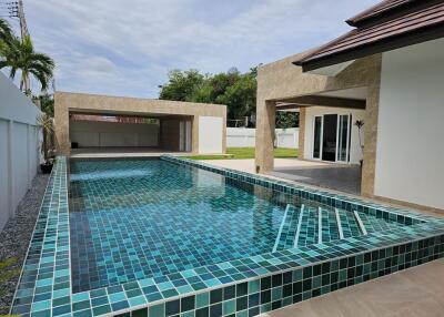 Modern house with a swimming pool and patio area