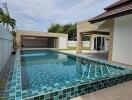 Modern house with a swimming pool and patio area