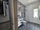 Modern bathroom with walk-in shower and closet