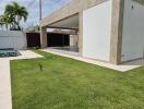 Outdoor yard with pool and covered patio area