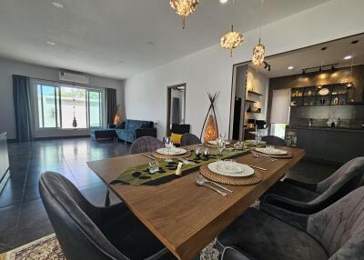 Spacious open-plan dining and living room with modern decor