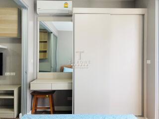 Bedroom with mirrored closet and desk