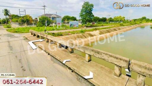 View of a bridge over a waterway near a residential area