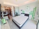 Modern bedroom with minimalistic design and green accents