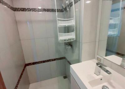 Modern bathroom with shower, sink, and mirror