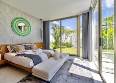 Modern bedroom with large windows and garden view