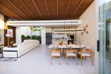 Open plan living room and kitchen with dining area