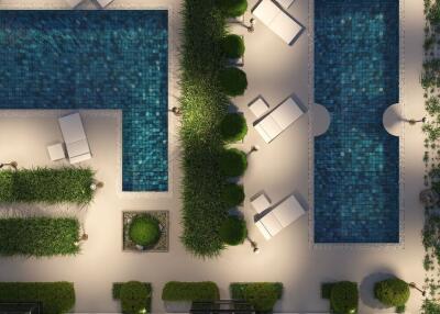 Aerial view of outdoor pool area with lounge chairs and greenery