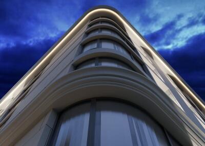 Corner view of a modern building exterior against evening sky