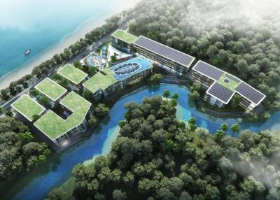 Aerial view of modern eco-friendly green-roofed building complex surrounded by water and trees