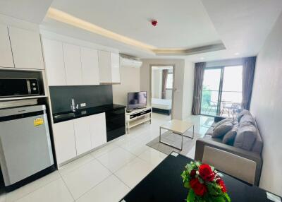 Modern kitchen and living room with balcony