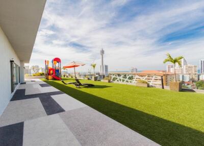 Rooftop terrace with playground and city view