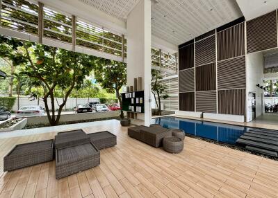 Modern outdoor common area with seating and pool