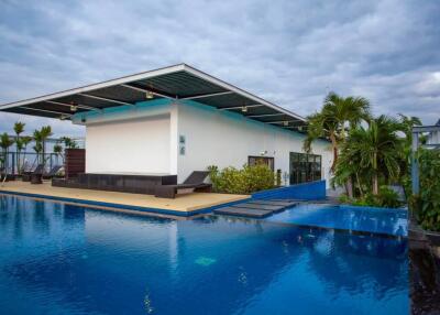 Modern rooftop pool with adjacent building