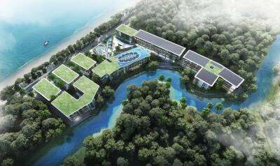 Aerial view of a modern apartment complex surrounded by water and trees