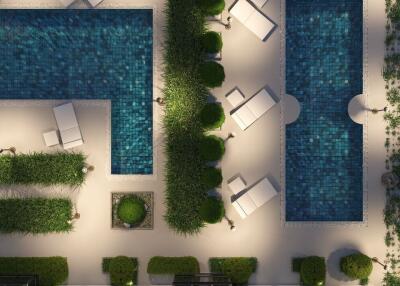 Aerial view of an outdoor pool area with lounge chairs and greenery