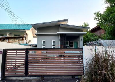 A single-story, contemporary style house with 3 bedrooms and 2 bathrooms in the Saraphi zone.