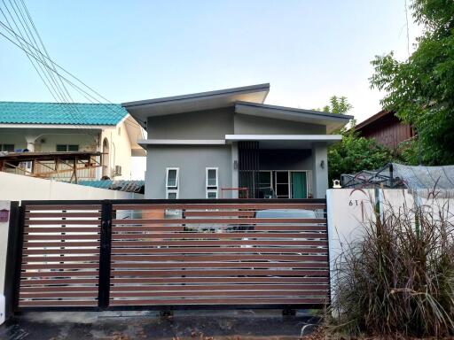A single-story, contemporary style house with 3 bedrooms and 2 bathrooms in the Saraphi zone.