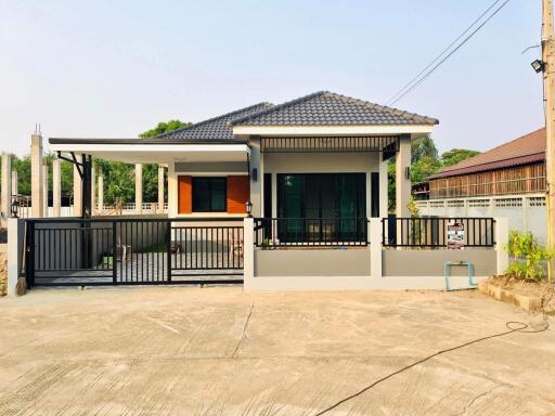 A single-story, contemporary style house with 3 bedrooms and 2 bathrooms in the San Pa Tong zone.