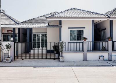 A single-story, contemporary style house with 3 bedrooms and 2 bathrooms in the Saraphi zone.