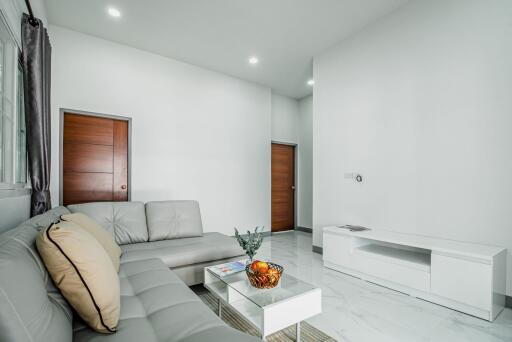 A single-story, contemporary style house with 3 bedrooms and 2 bathrooms in the Saraphi zone.