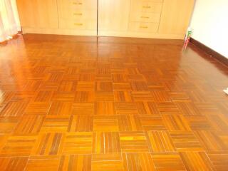 Bedroom with wooden parquet floor