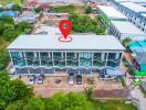 Aerial view of a commercial building with a parking lot