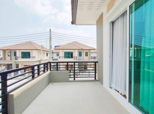 Spacious balcony with a view of neighboring houses