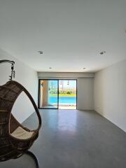 Spacious living area with a view of the pool