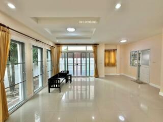 Spacious living room with large windows and natural light