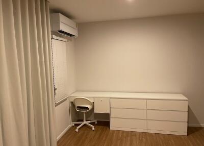 Minimalist bedroom with desk and chair