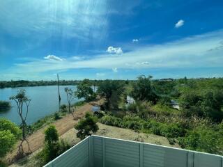 Scenic view of a river and greenery from the balcony