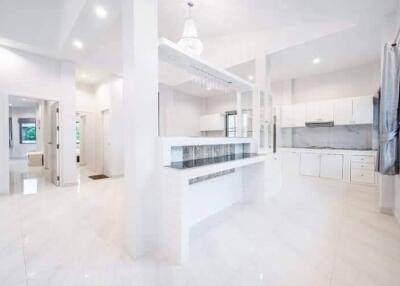 Modern white kitchen with open layout