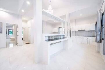 Modern white kitchen with open layout