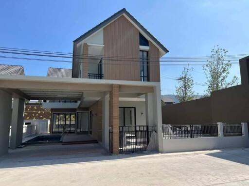 Modern two-story house with carport and front yard