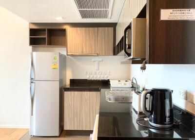 Modern kitchen with built-in appliances and storage