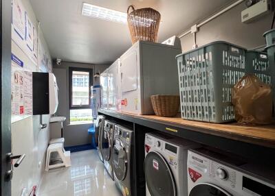 Laundry room with washing machines and dryers