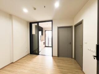 Spacious open living area with kitchen view