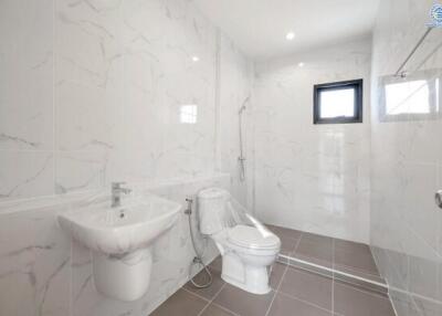 Modern bathroom with marble tiles and sanitary fixtures