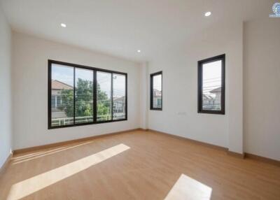 Spacious bedroom with large windows