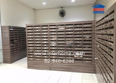 Mailroom with multiple mailboxes in an apartment building